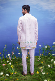 Pink linen kurta set, a comfortable and stylish ethnic wear option for men, presented on a product page.