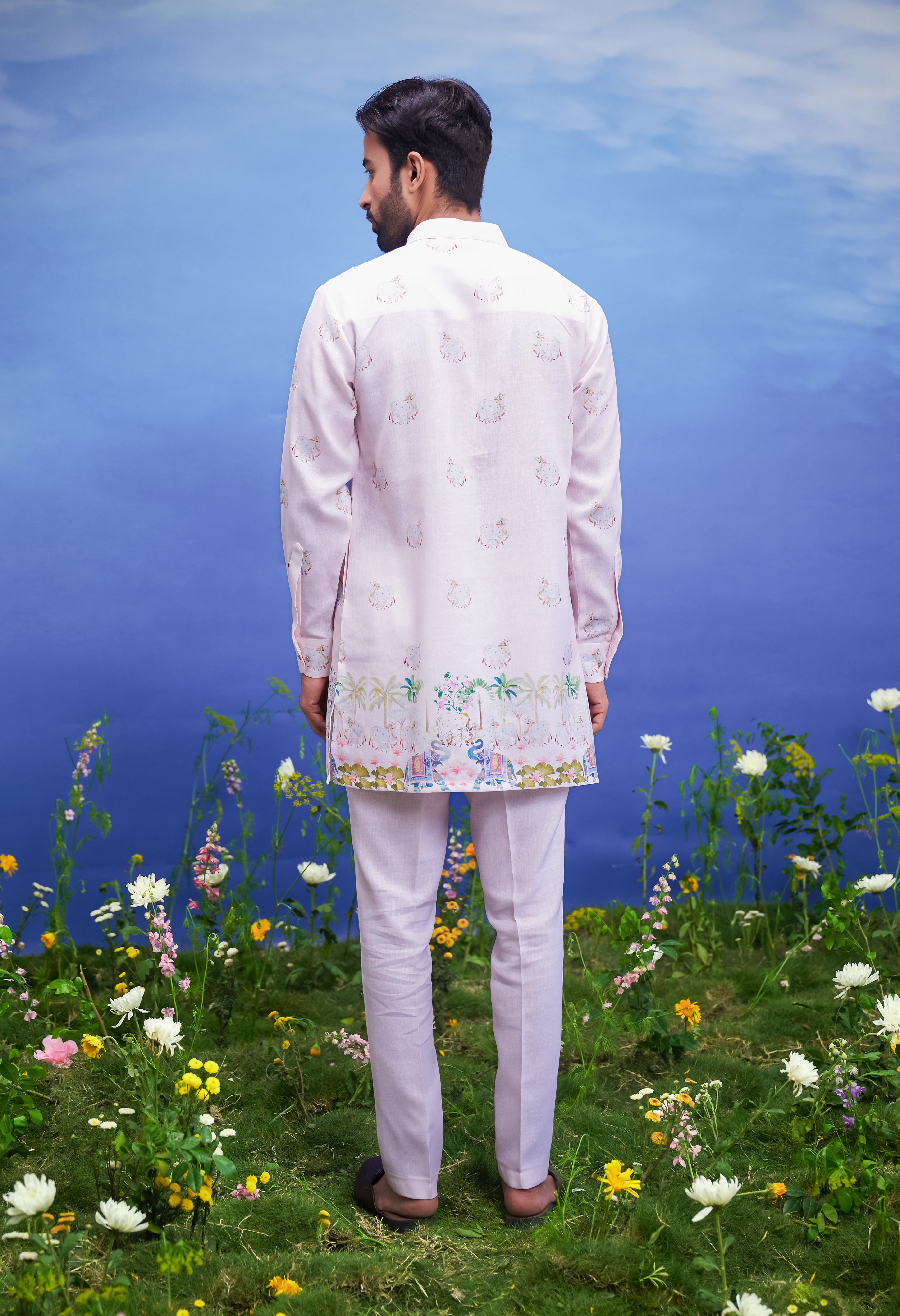 Pink linen kurta set, a comfortable and stylish ethnic wear option for men, presented on a product page.