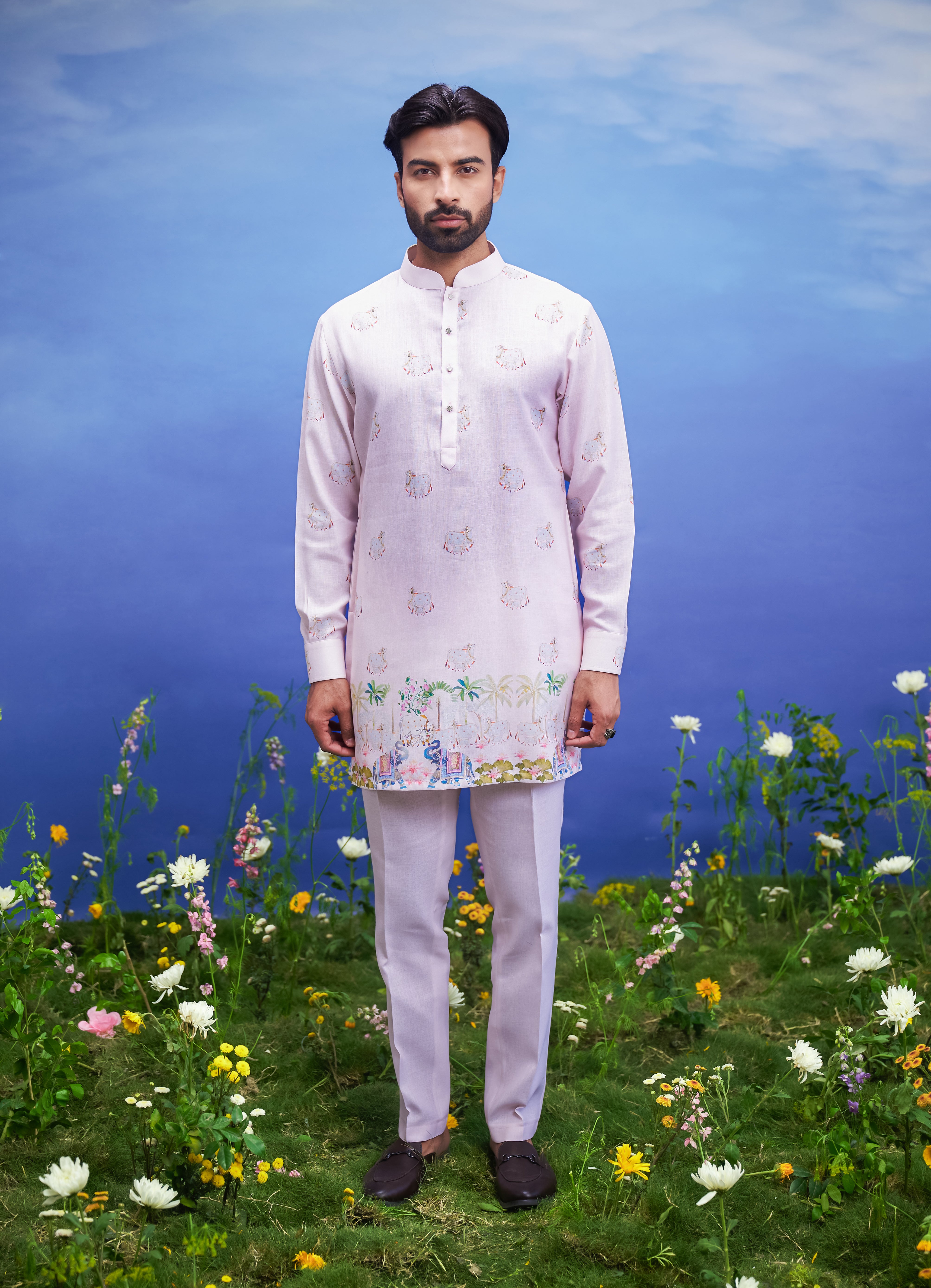 Men's pink kurta set made of linen blend, displayed on a product page with size options.