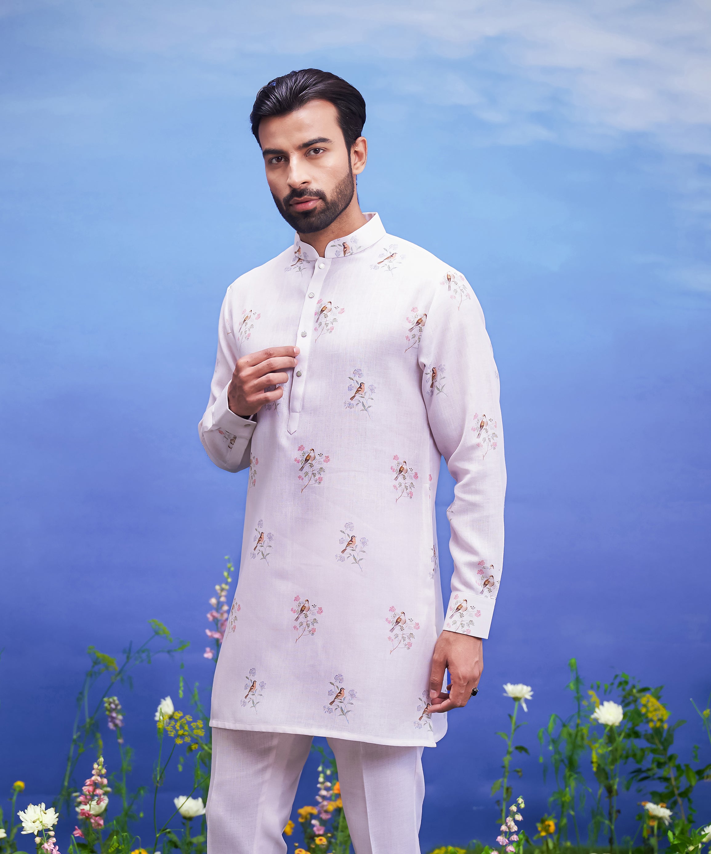 Men's pink kurta set made of linen blend, displayed on a product page with size options.