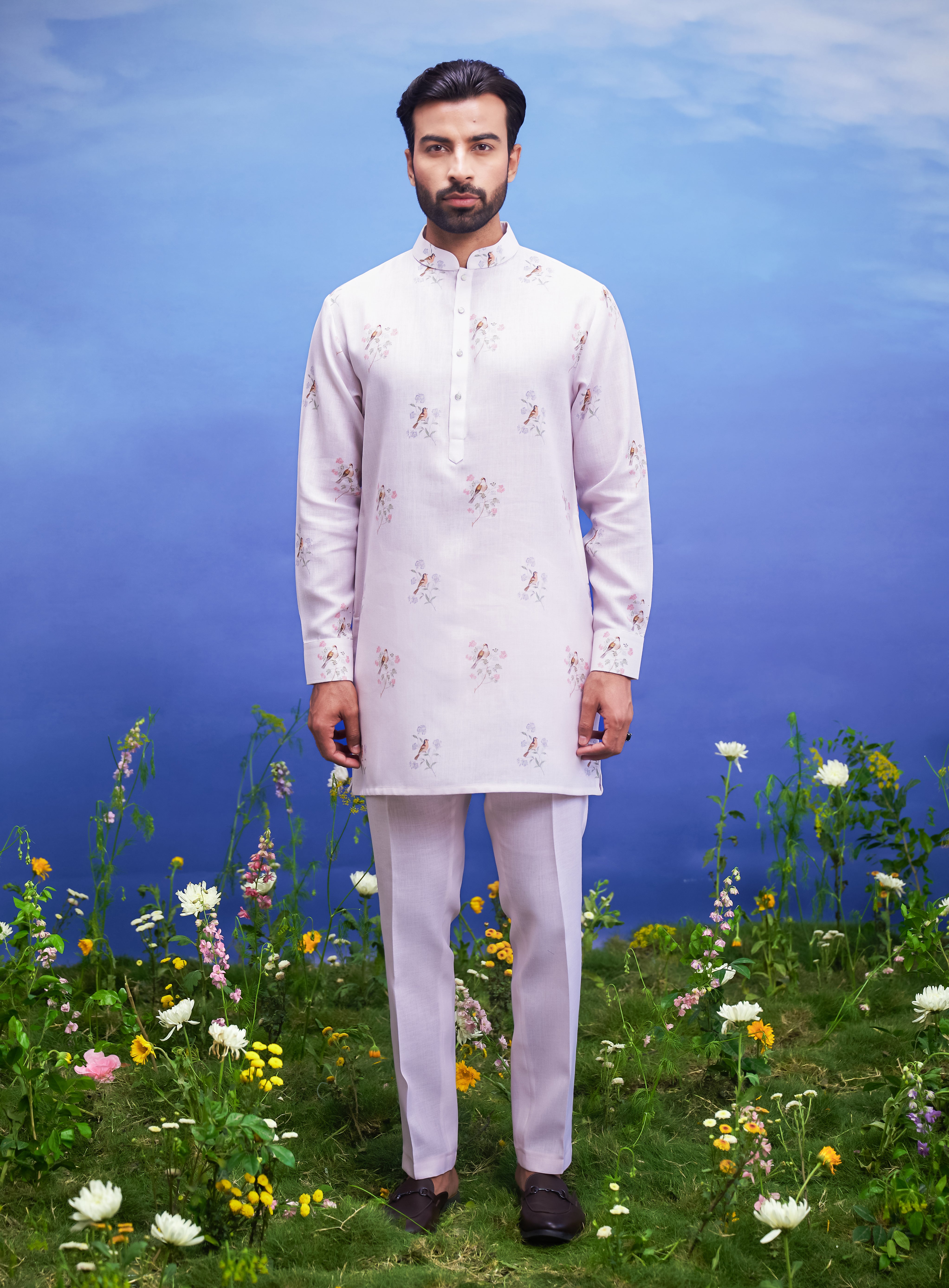Men's pink kurta set featuring a linen blend kurta and bottom, with potential men's accessories like a jacket and pin.