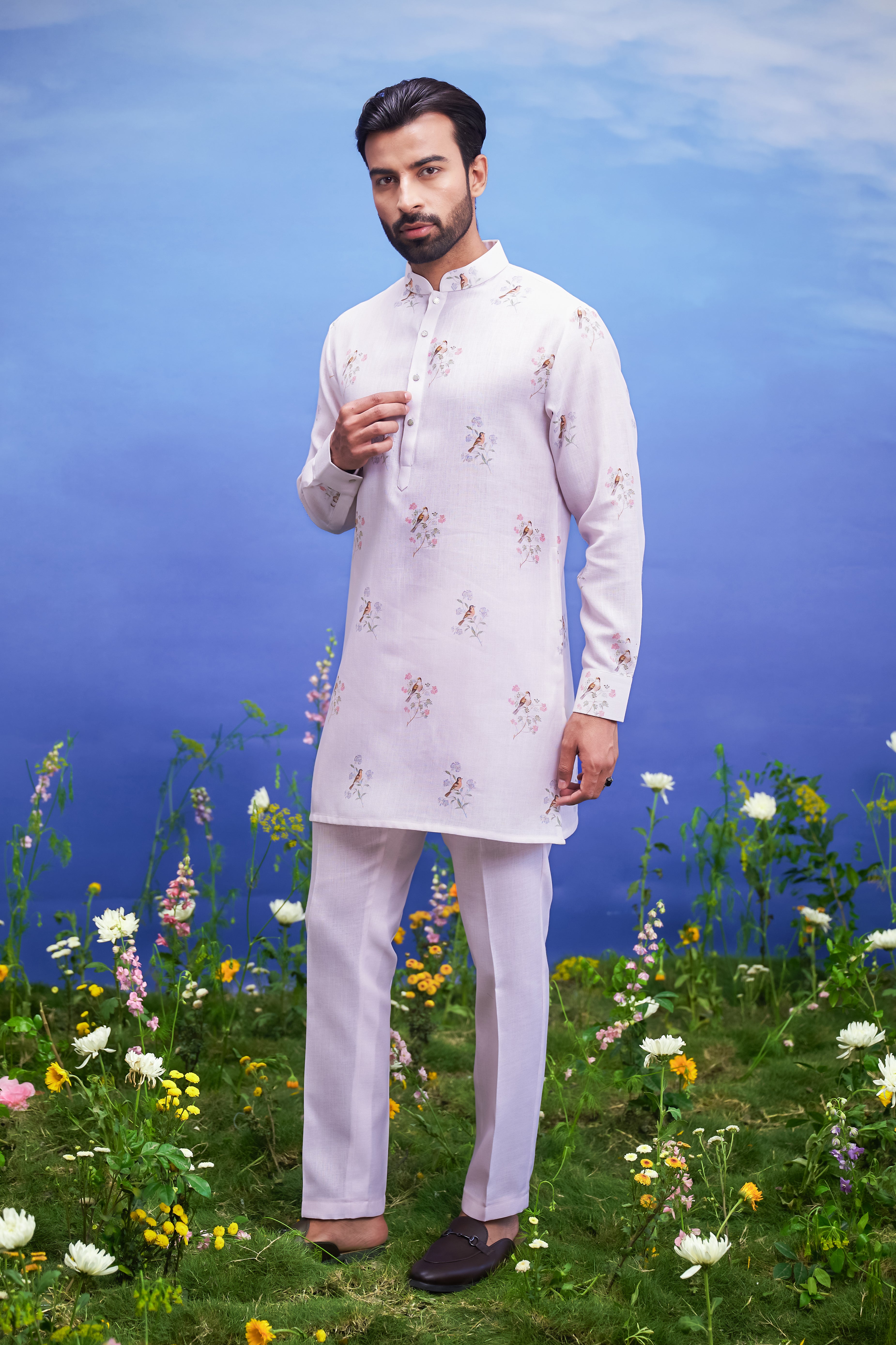 Pink linen kurta set for men, combining traditional comfort with contemporary male style.