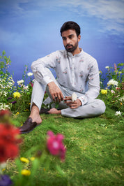 Mint green kurta set made of linen blend, displayed on a product page with size options.