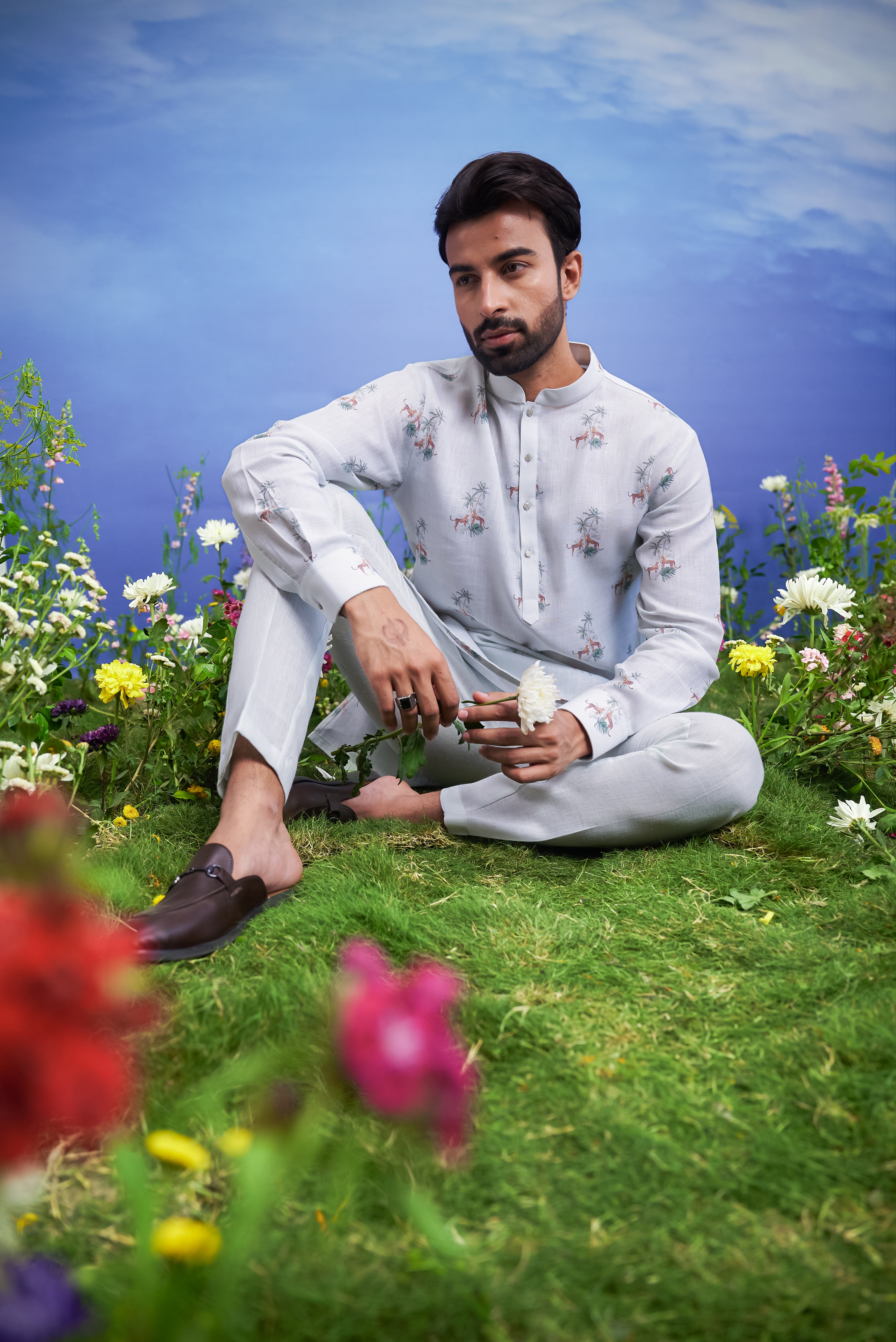 Mint green kurta set made of linen blend, displayed on a product page with size options.