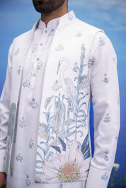 Men's white kurta jacket set with a floral print, displayed on a product page with size options.