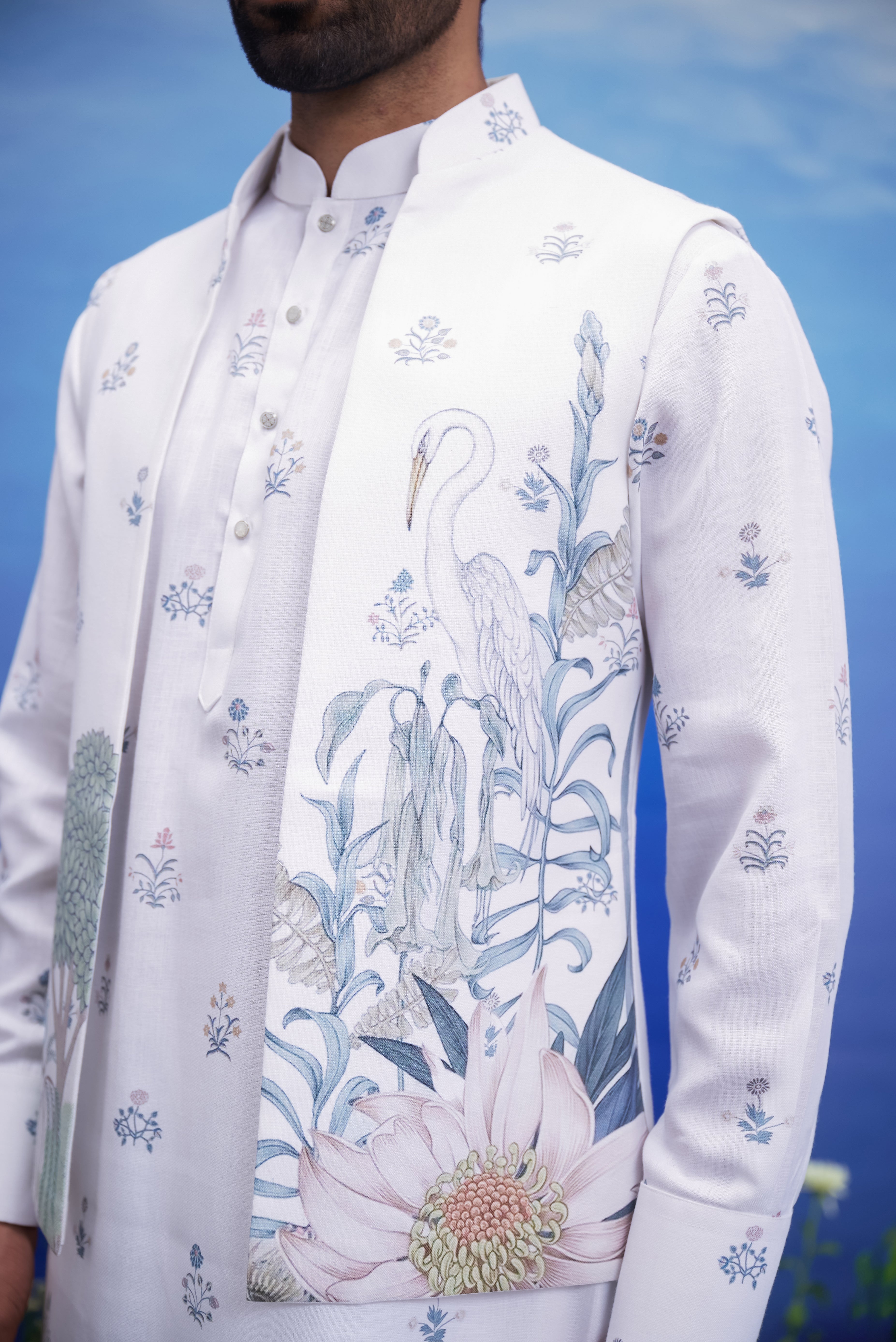 Men's white kurta jacket set with a floral print, displayed on a product page with size options.