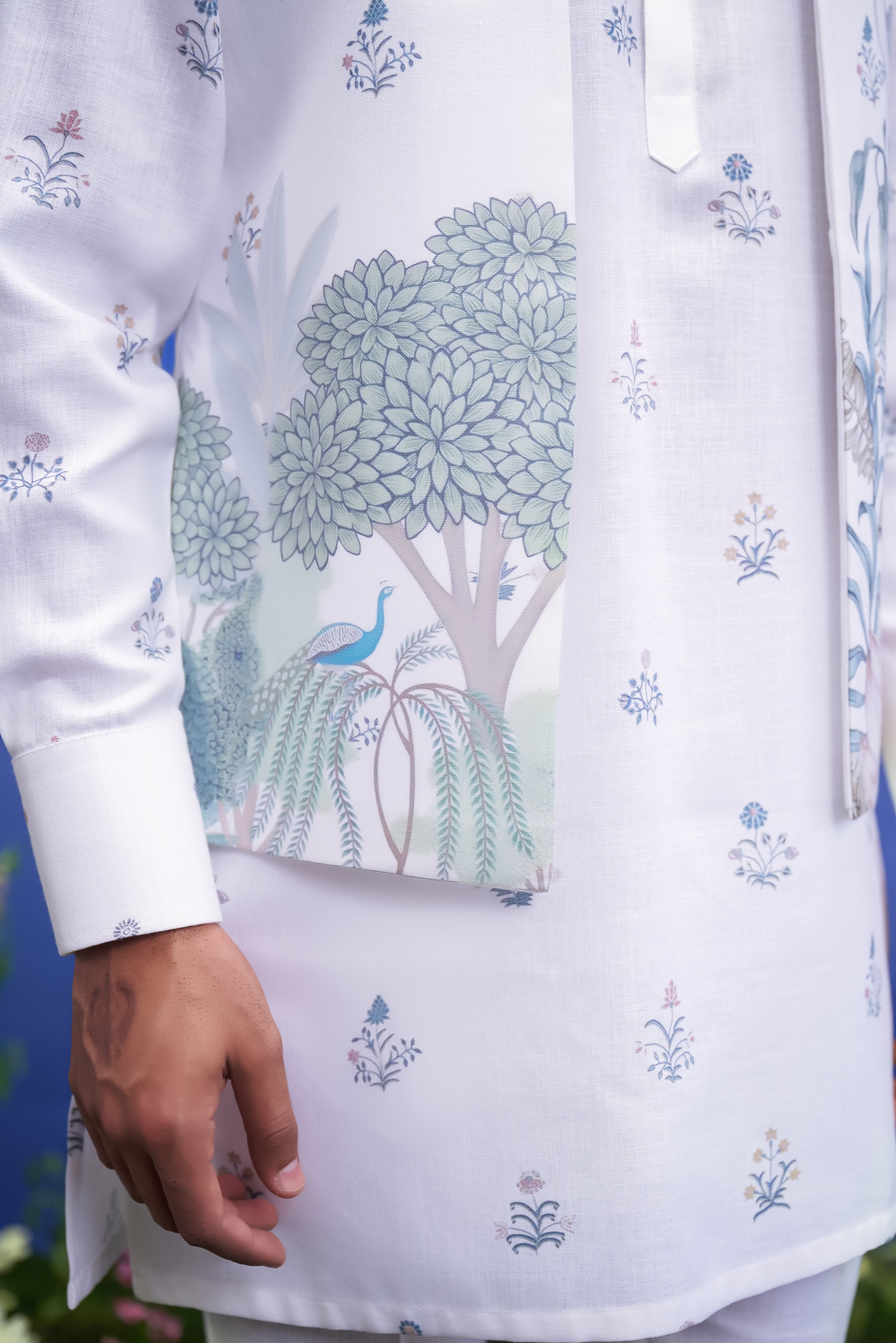 Close-up of the printed white kurta jacket set, highlighting the floral print and blended silk fabric texture.