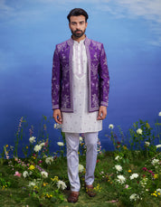 A purple Bandhgala with front open embroidered jacket, featuring a kurta, jacket, and pant cut pajama, ideal for men's ethnic wear.