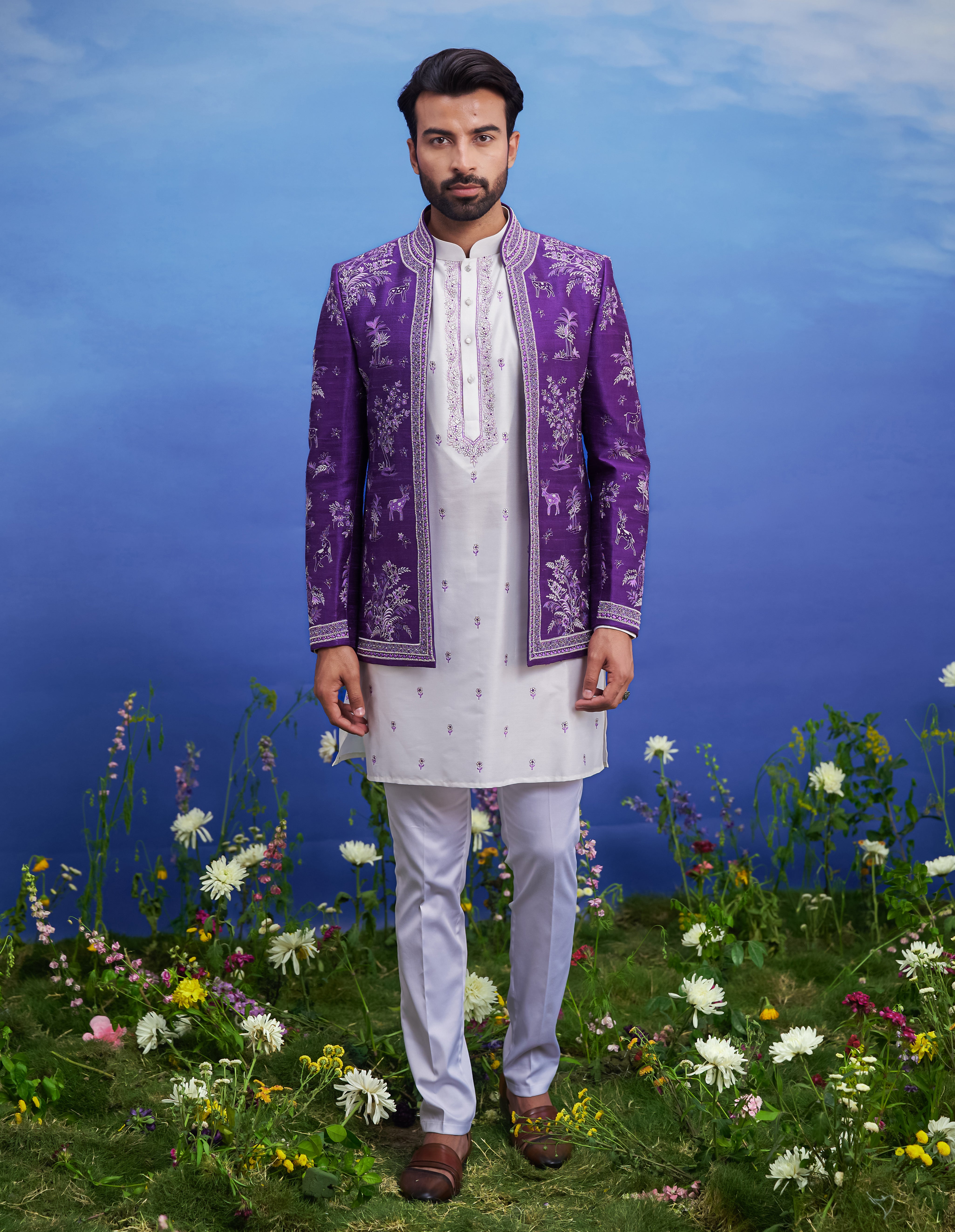 A purple Bandhgala with front open embroidered jacket, featuring a kurta, jacket, and pant cut pajama, ideal for men's ethnic wear.