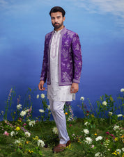 Men's purple raw silk front open embroidered Bandhgala featuring a blended silk kurta, raw silk jacket, and pant cut pajama.