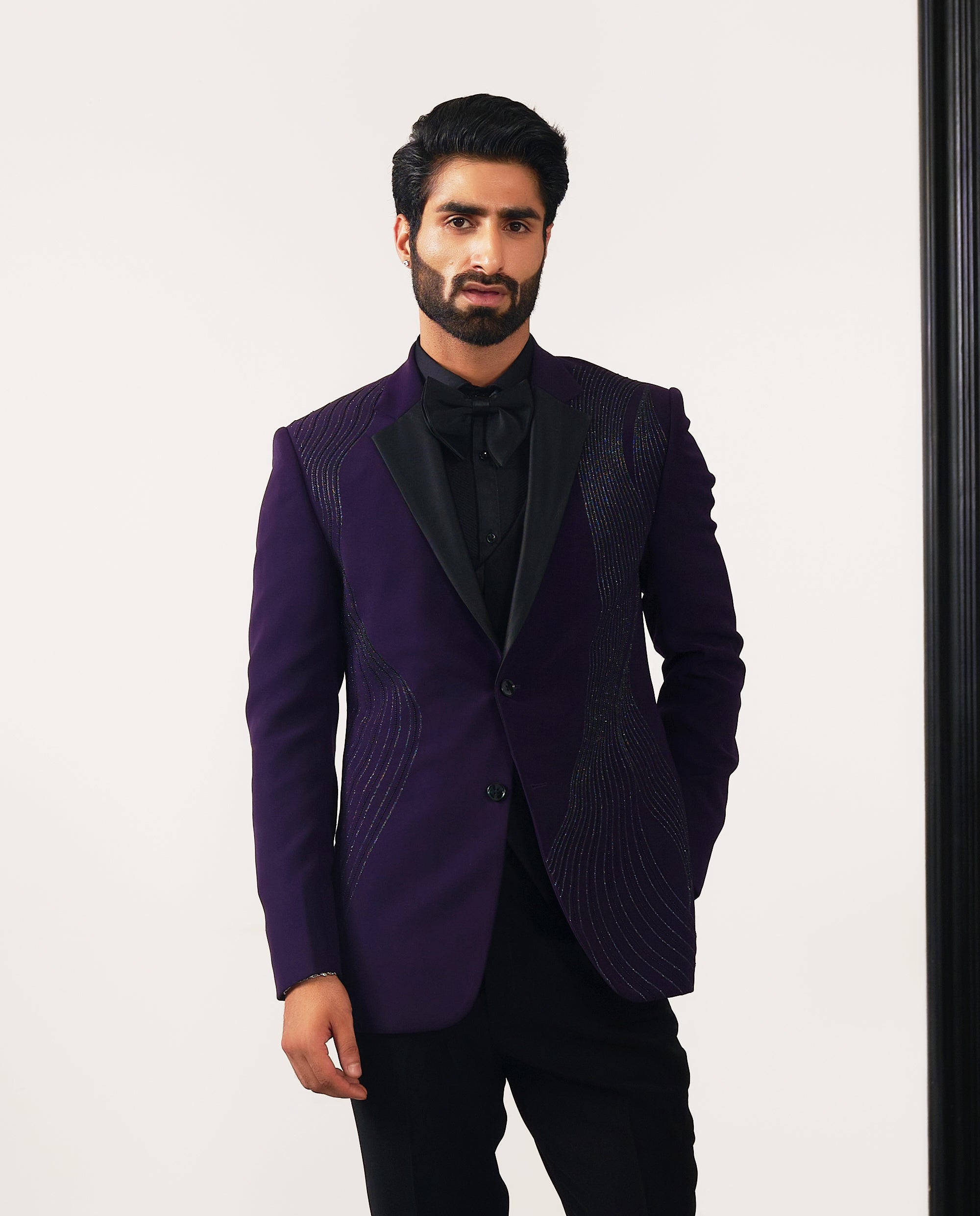 A trendy purple suit with front designer work, urban style.
