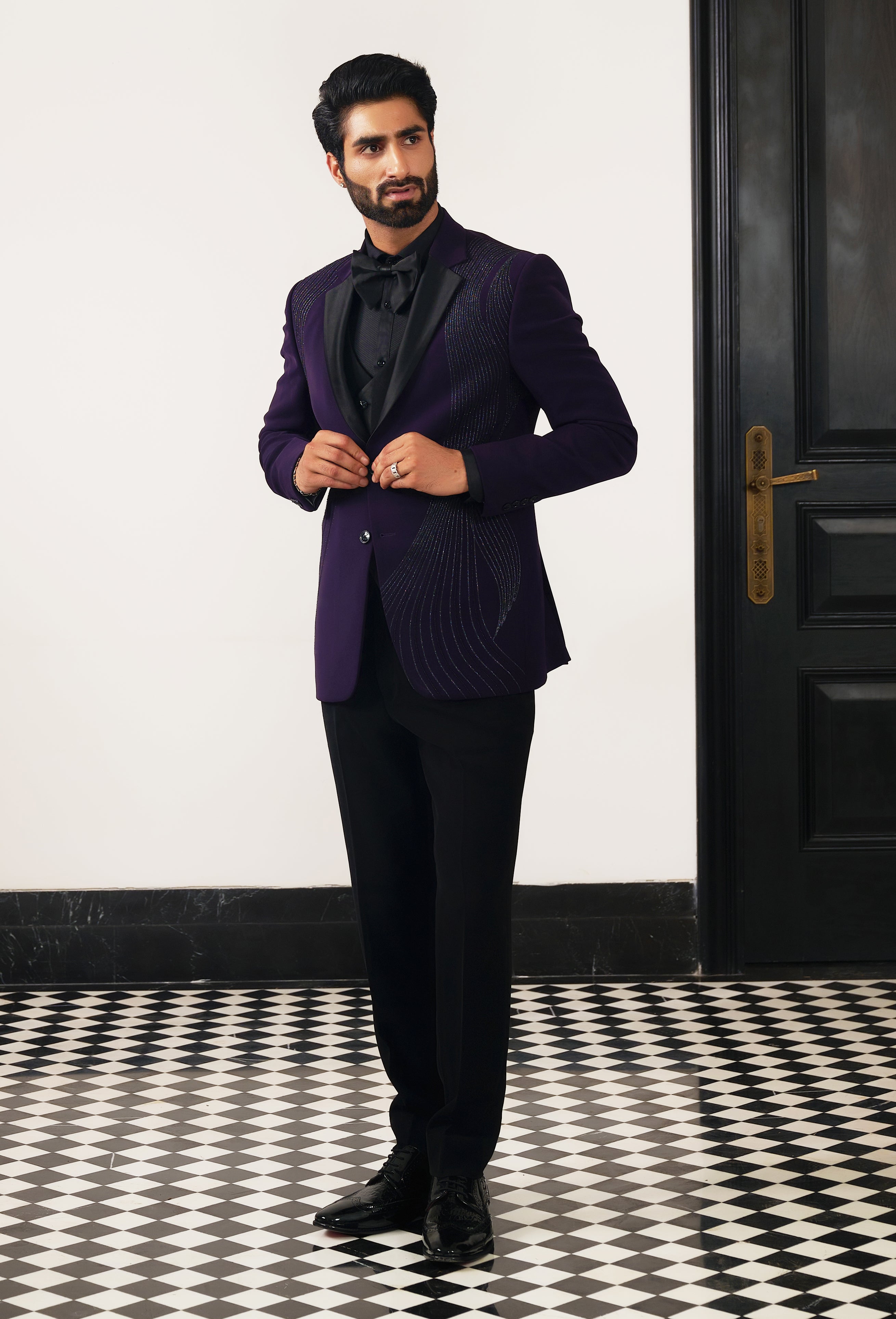 A stylish purple suit with front designer work, perfect for weddings and formal occasions.
