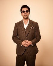 Brown pinstripe 3-piece suit inspired by Rajkummar Rao, featuring a tailored suit, same waistcoat, and trousers in premium wool-feel fabric with a sharp modern fit, ideal for weddings, formal events, business wear, and celebrations.
