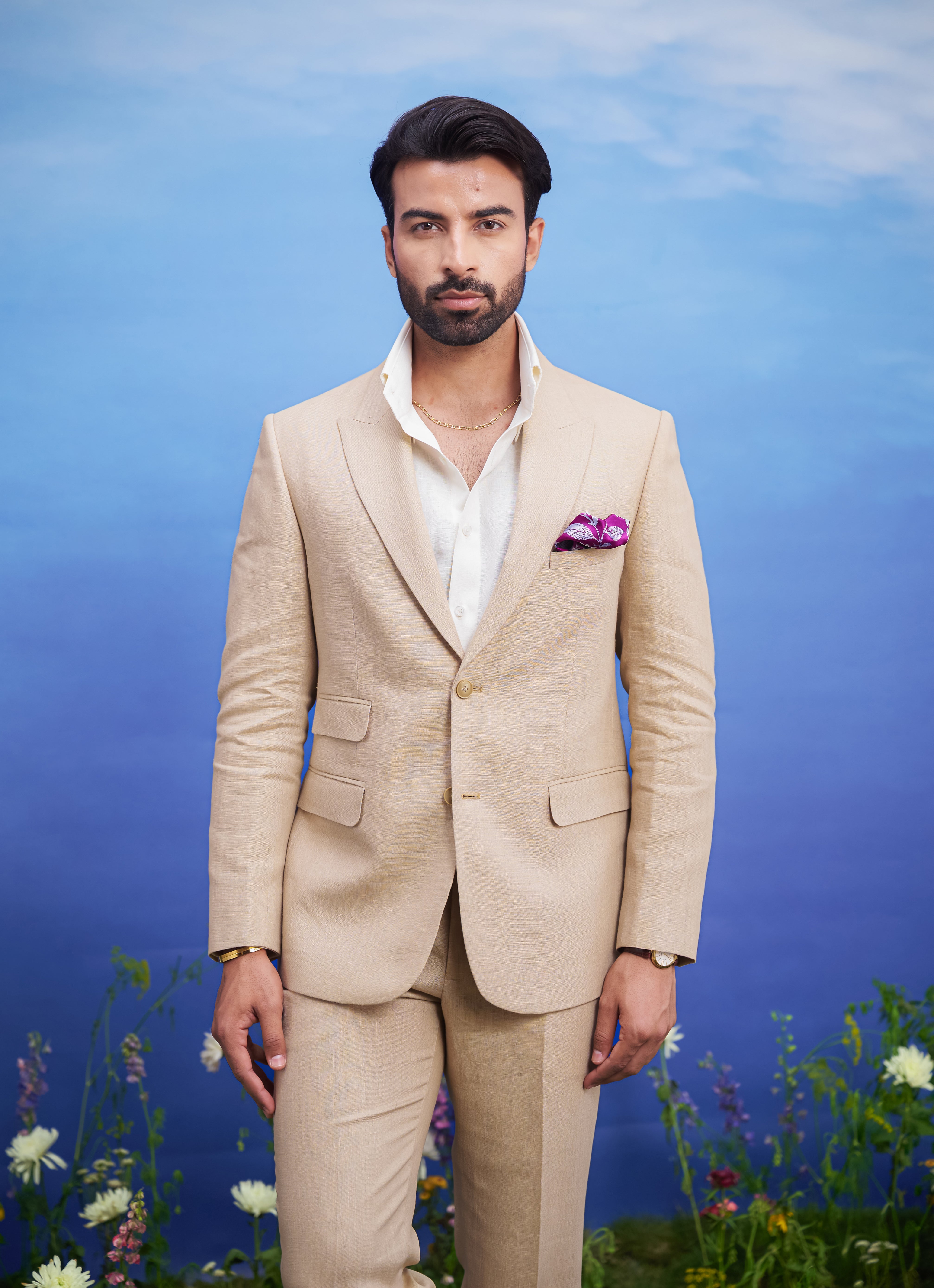 Men's tan linen suit, displayed on a product page with size options.