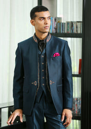 A stylish teal embroidered suit with cravat, perfect for weddings and formal occasions.
