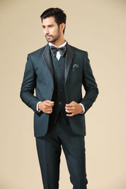 A luxurious teal embroidered tuxedo suit, a timeless classic.
