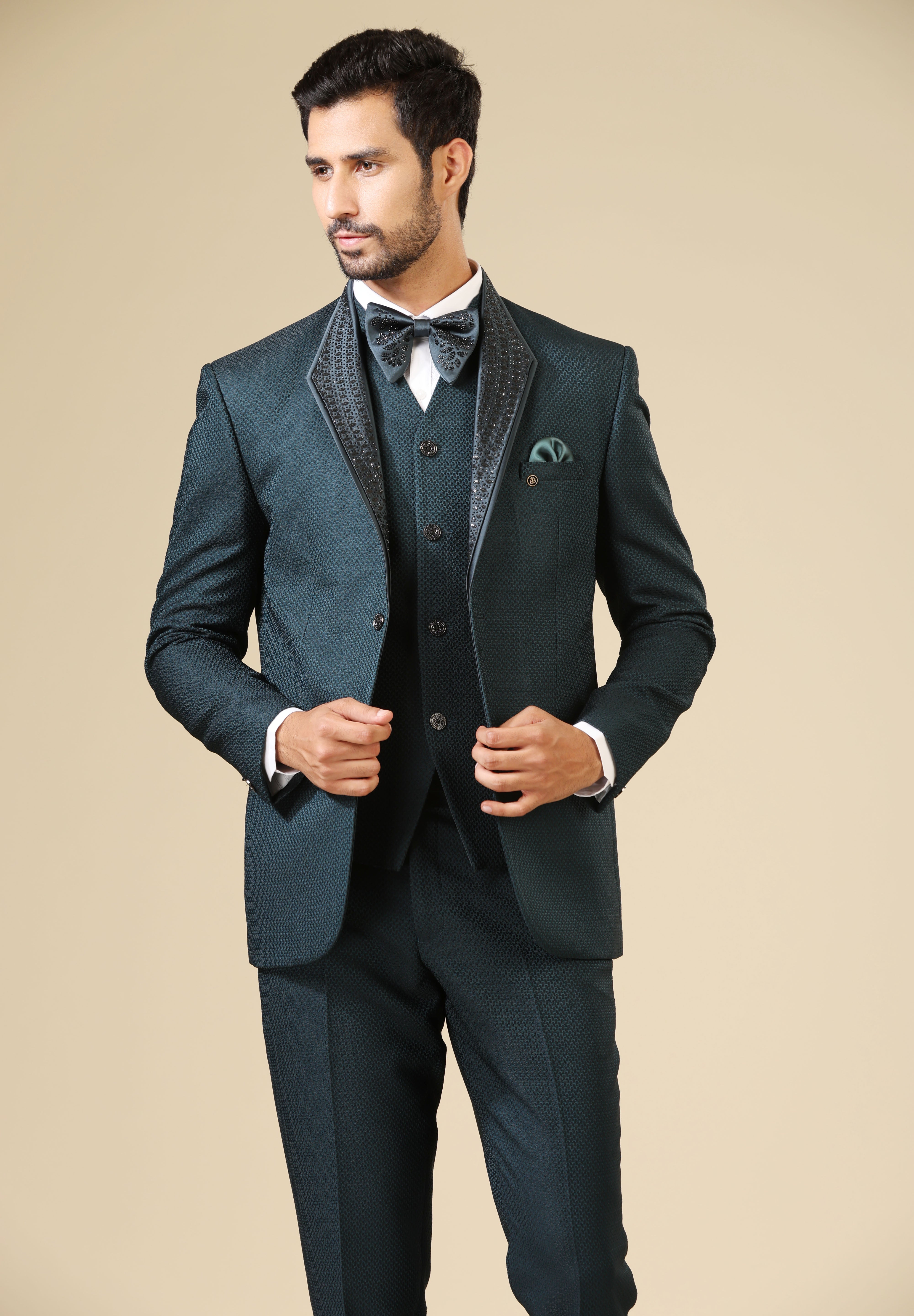 A luxurious teal embroidered tuxedo suit, a timeless classic.
