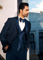 A trendy teal suit with designer vest, urban style.
