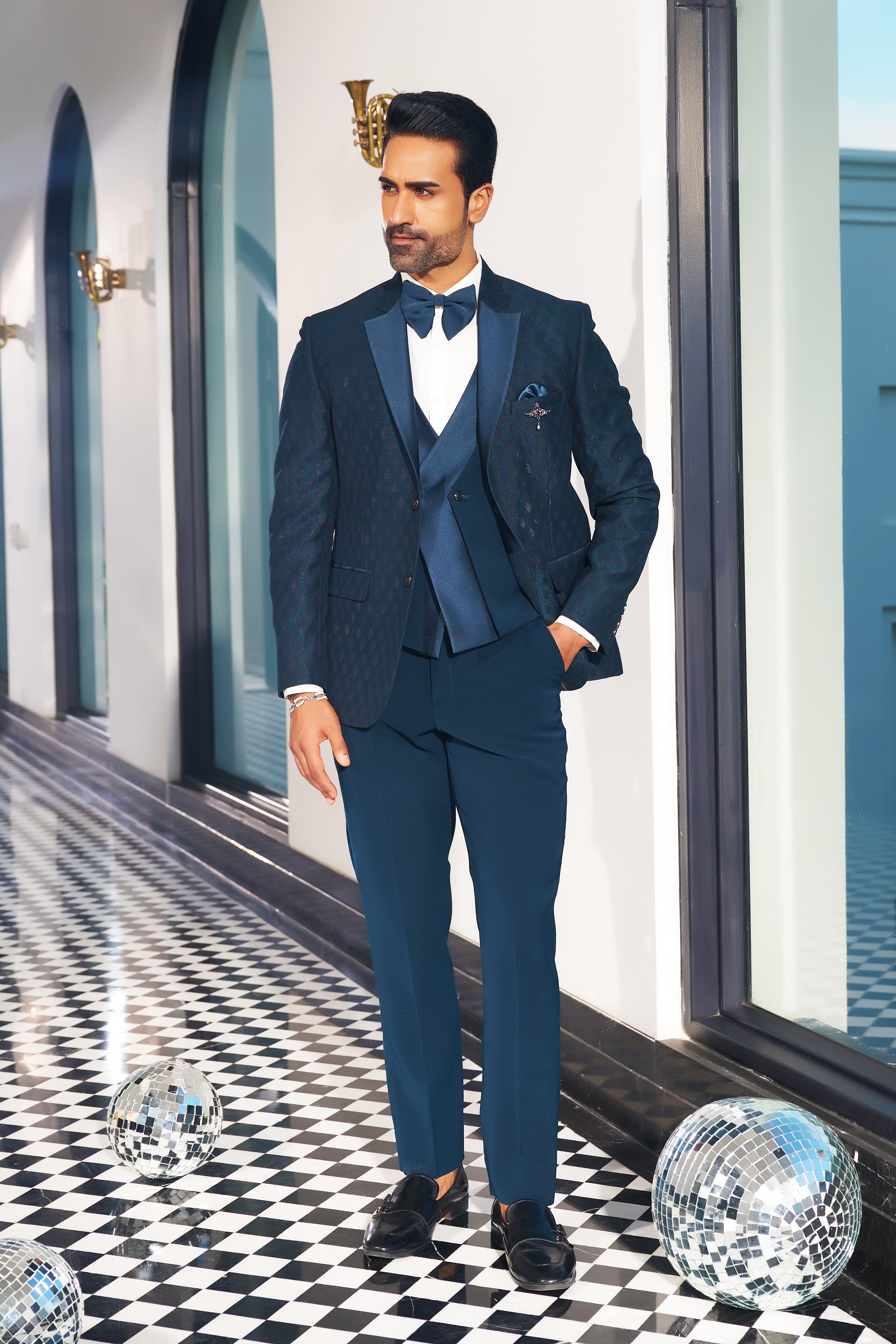 A stylish teal suit with designer vest, perfect for weddings and formal occasions.
