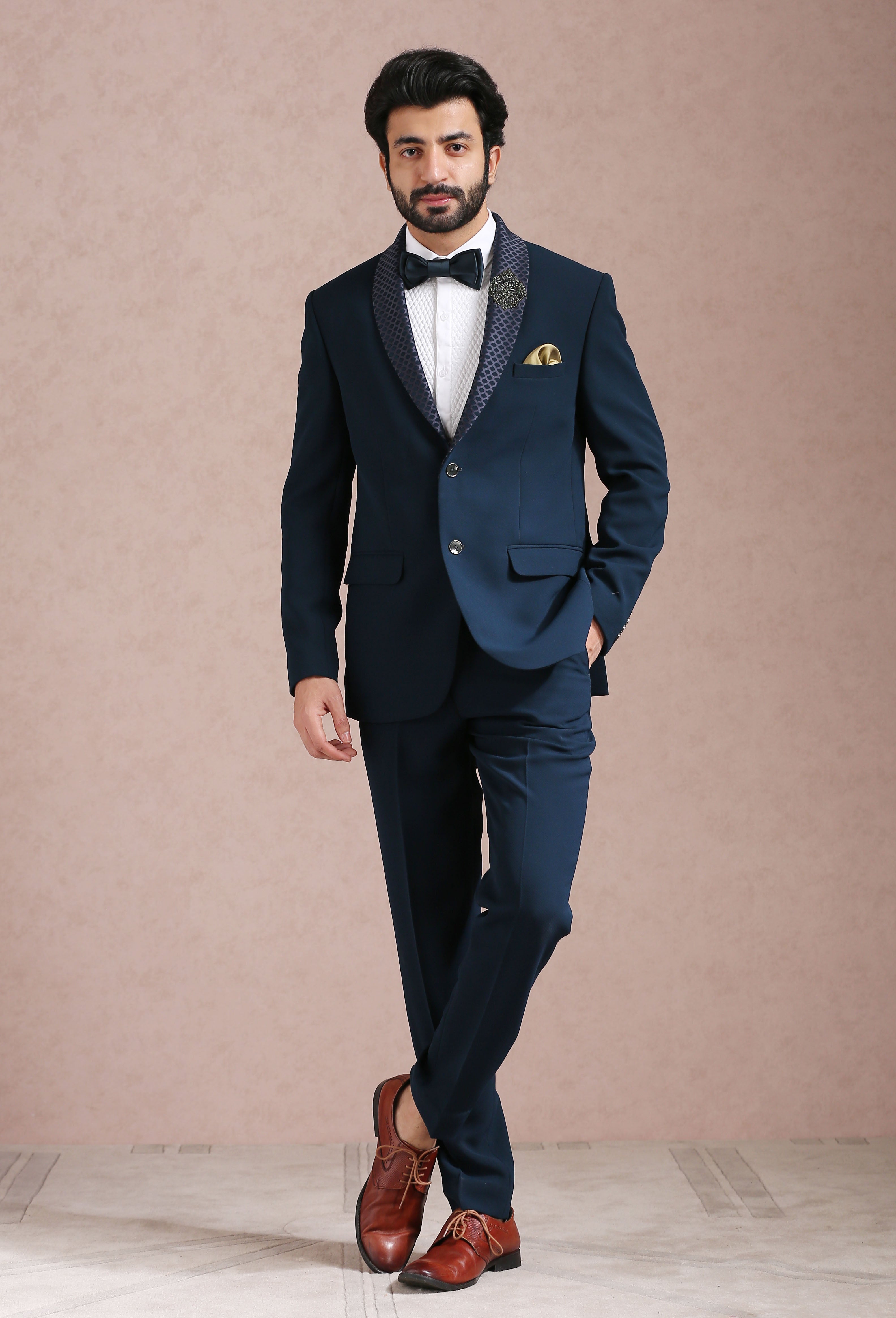 A stylish teal suit with embroidered motif, perfect for weddings and formal occasions.
