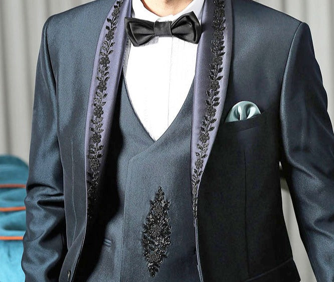  A Timeless Classic
Stylish Teal Designer Suit with Intricate Embroidery
