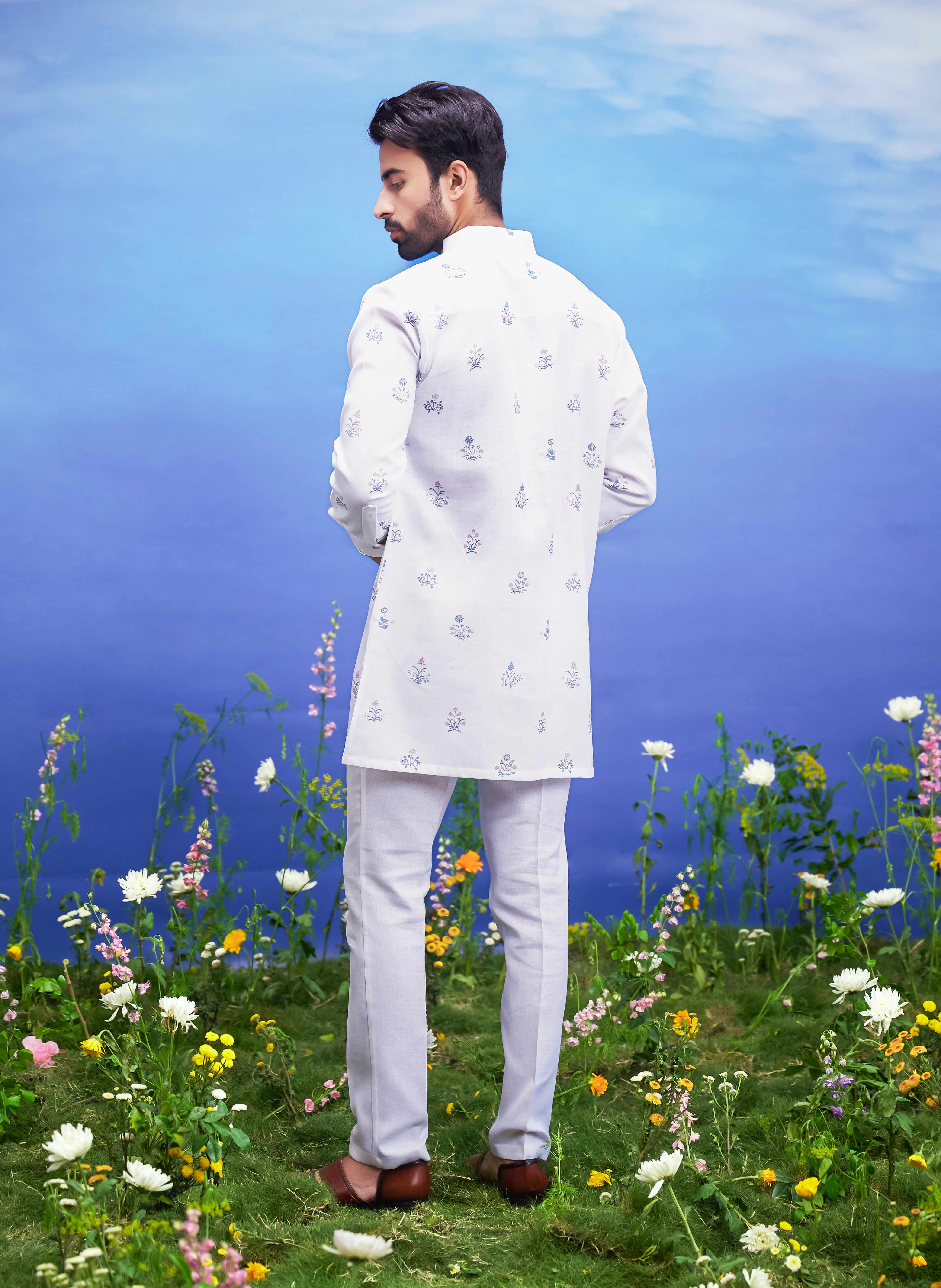 Men's white kurta set, a complete ethnic outfit made from linen blend fabric, displayed on a product page.