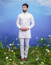 Men's white kurta set made of linen blend, displayed on a product page with size options.