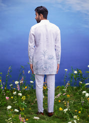A detailed view of the white linen kurta set, showcasing the fabric quality and design elements.