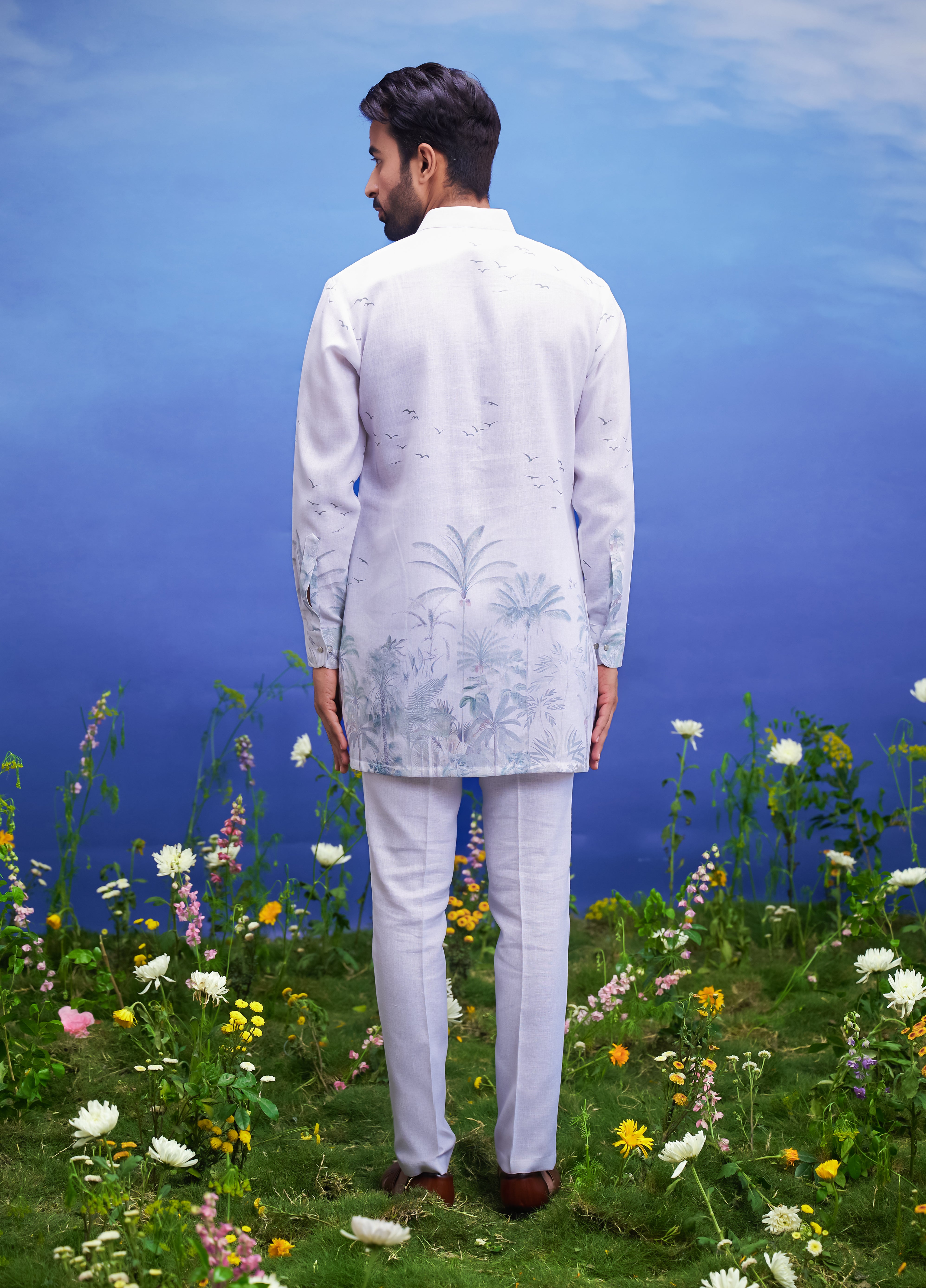A detailed view of the white linen kurta set, showcasing the fabric quality and design elements.