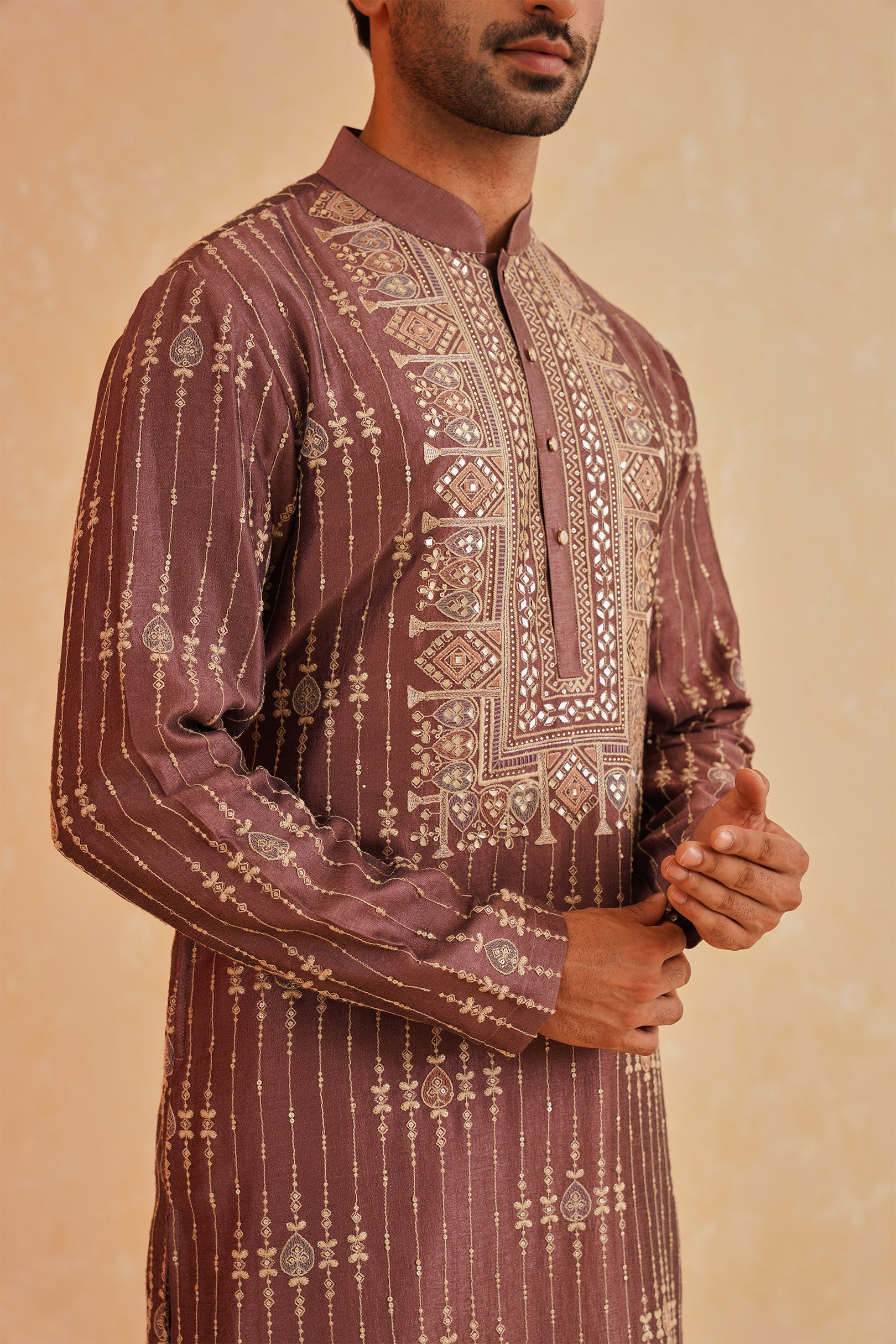  A Timeless Classic
Stylish Wine-Hued Kurta Set with Intricate Embroidery