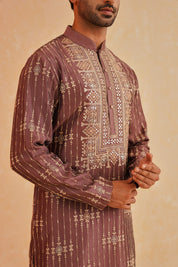  A Timeless Classic
Stylish Wine-Hued Kurta Set with Intricate Embroidery
