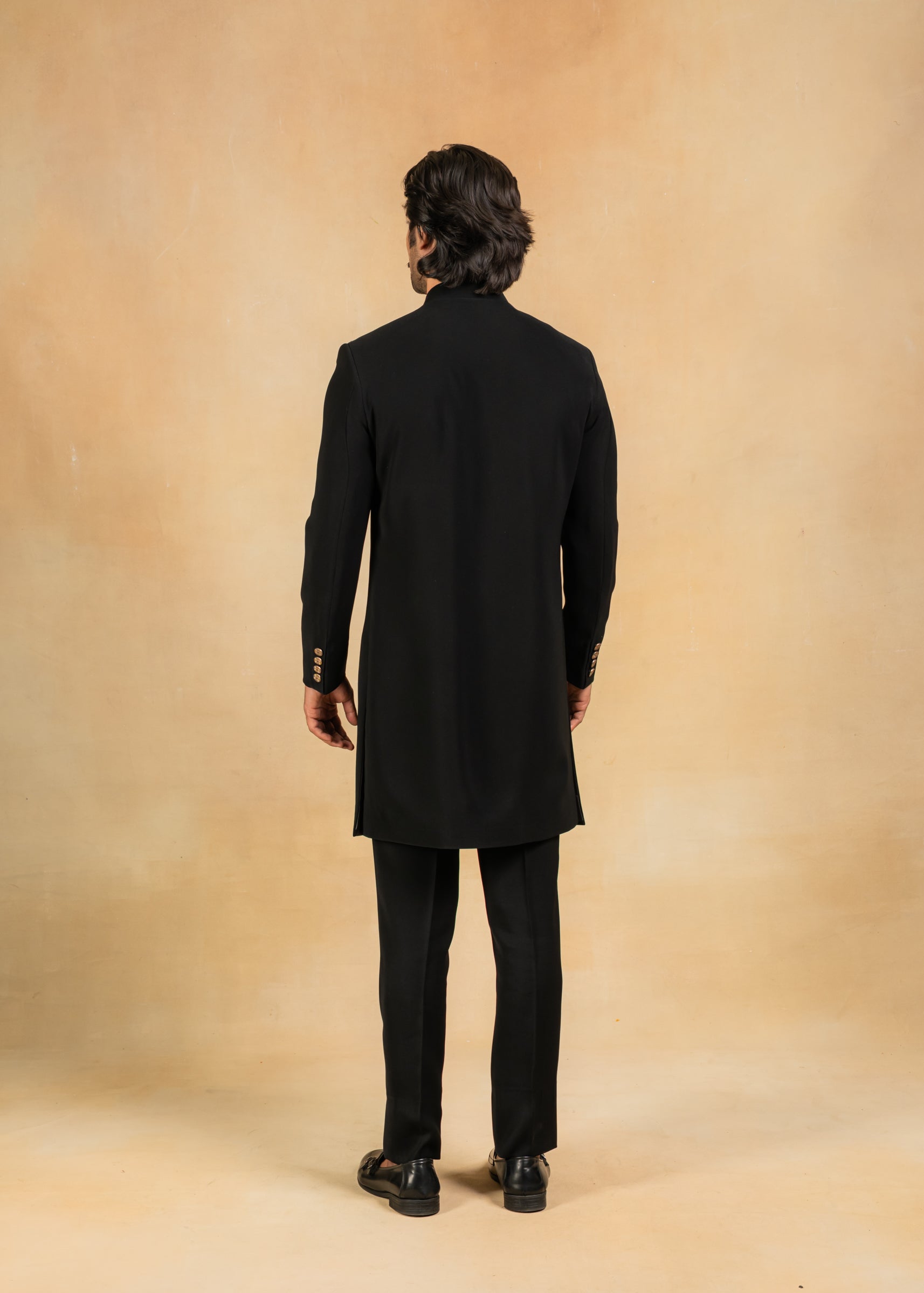 black indo-western with brooch and pintuck