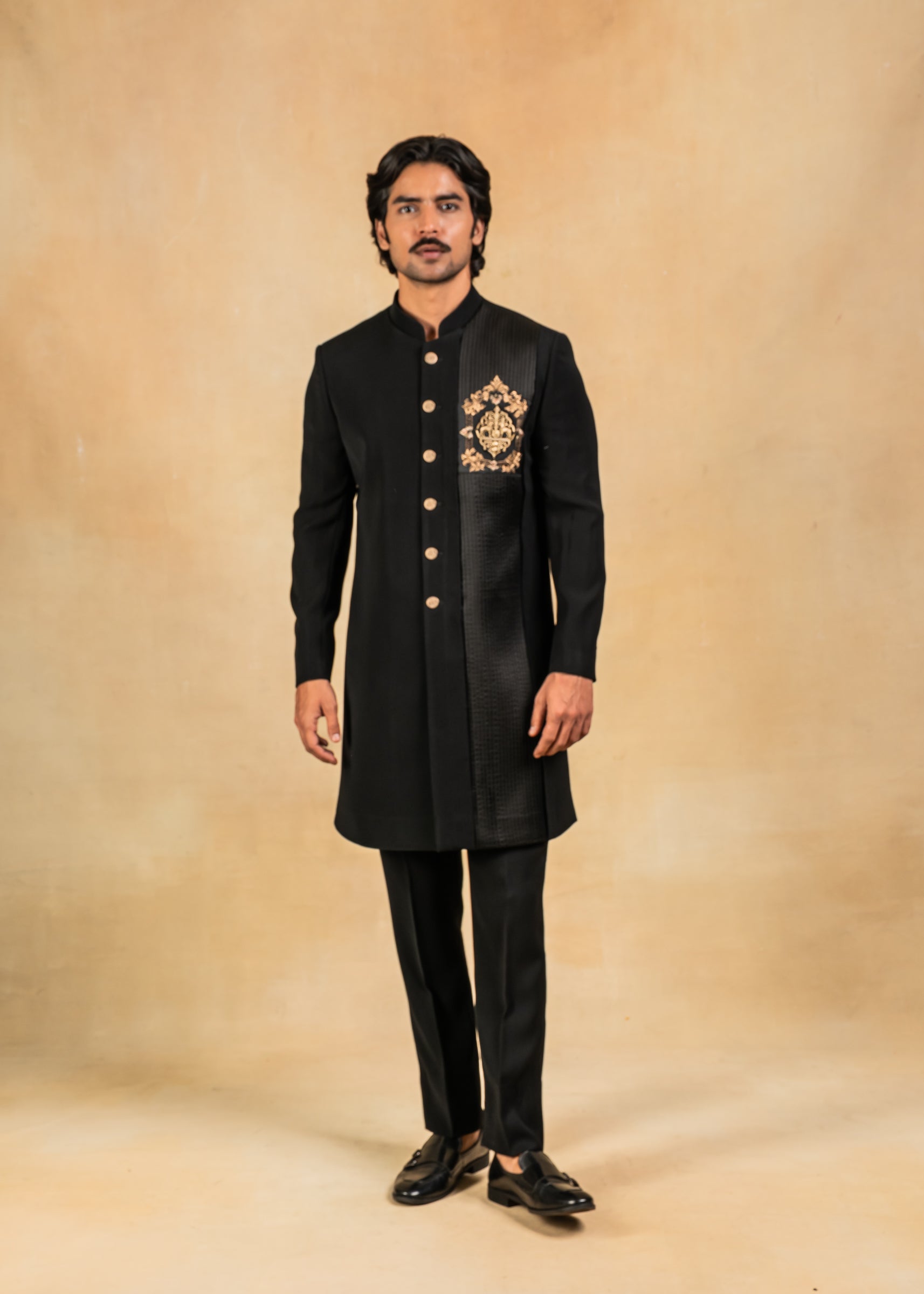 black indo-western with brooch and pintuck