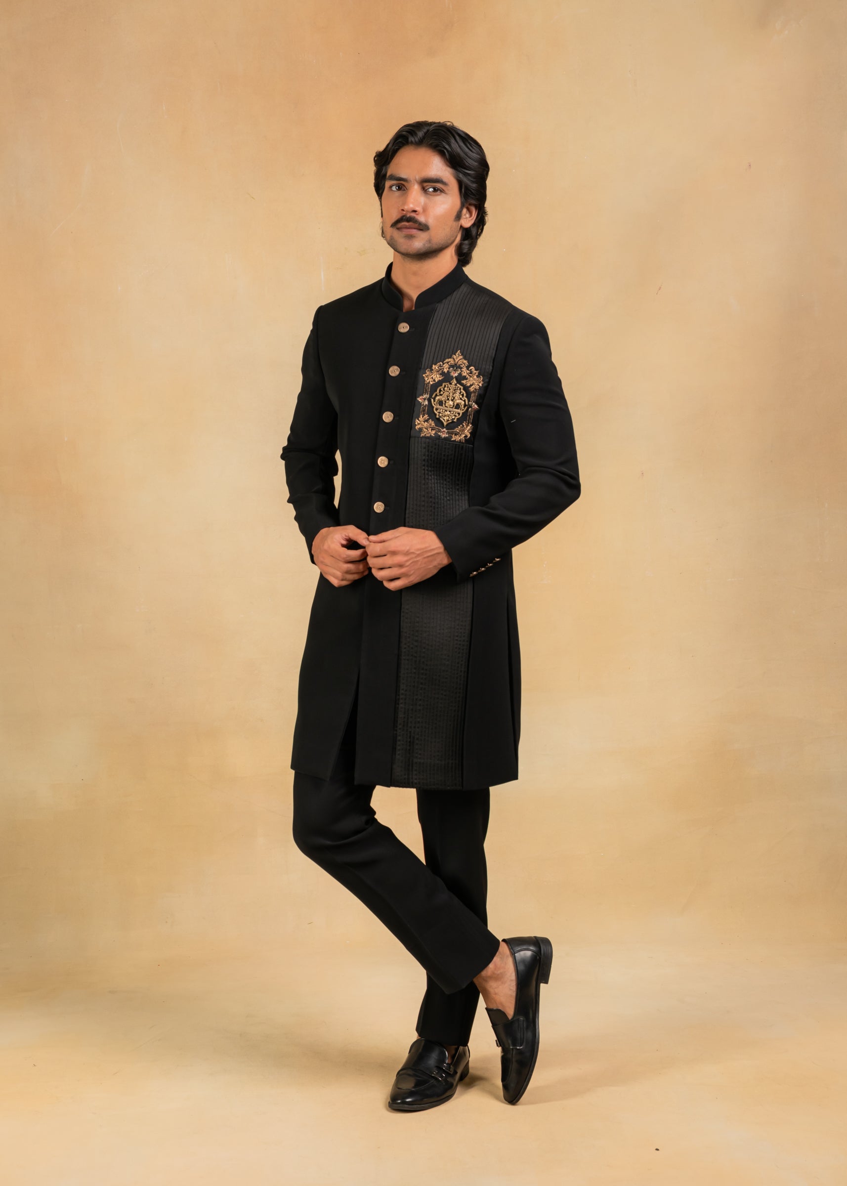 black indo-western with brooch and pintuck