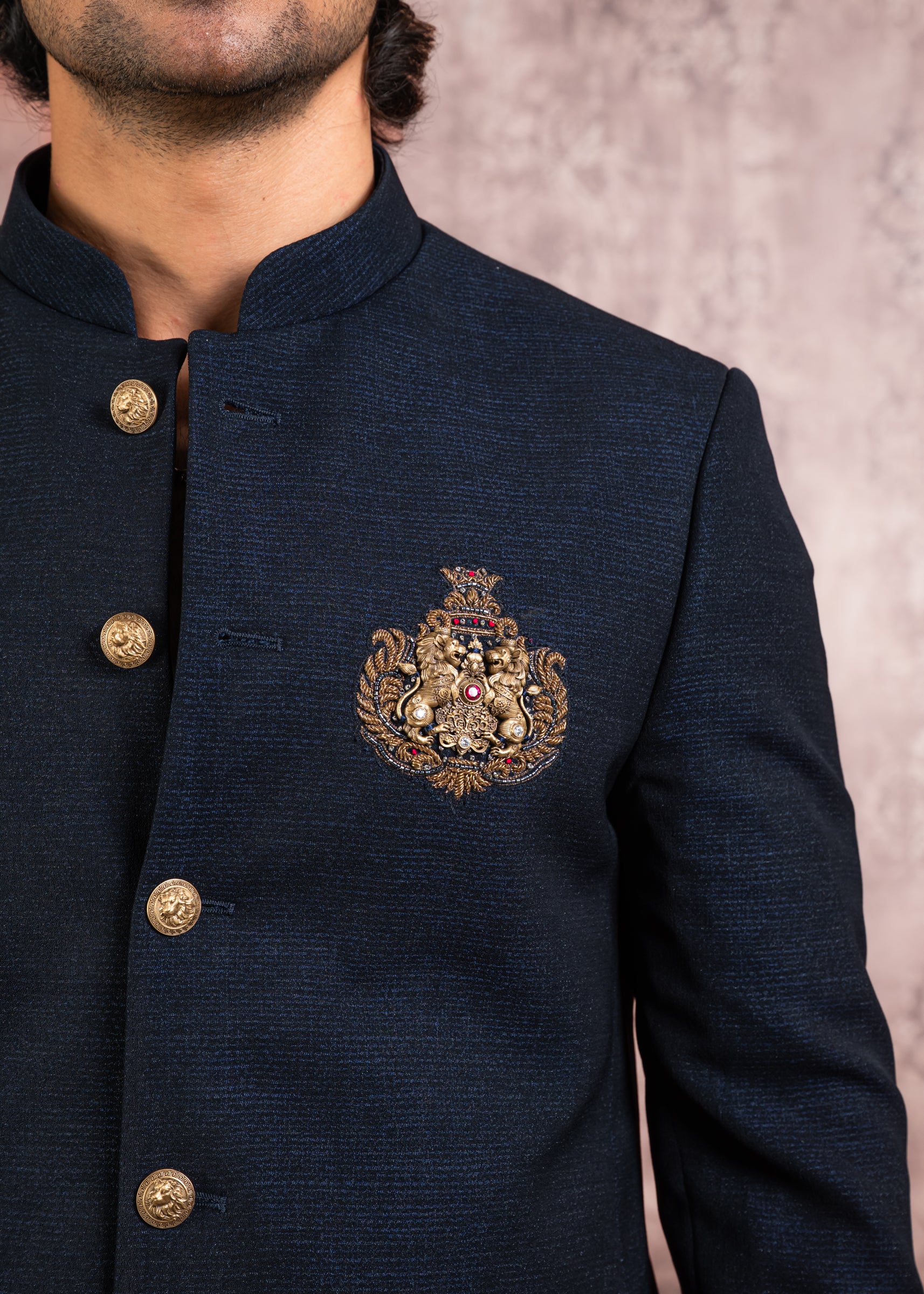 blue bandhgala with handcrafted lion brooch
