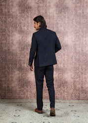 blue bandhgala with handcrafted lion brooch