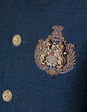 blue bandhgala with handcrafted lion brooch