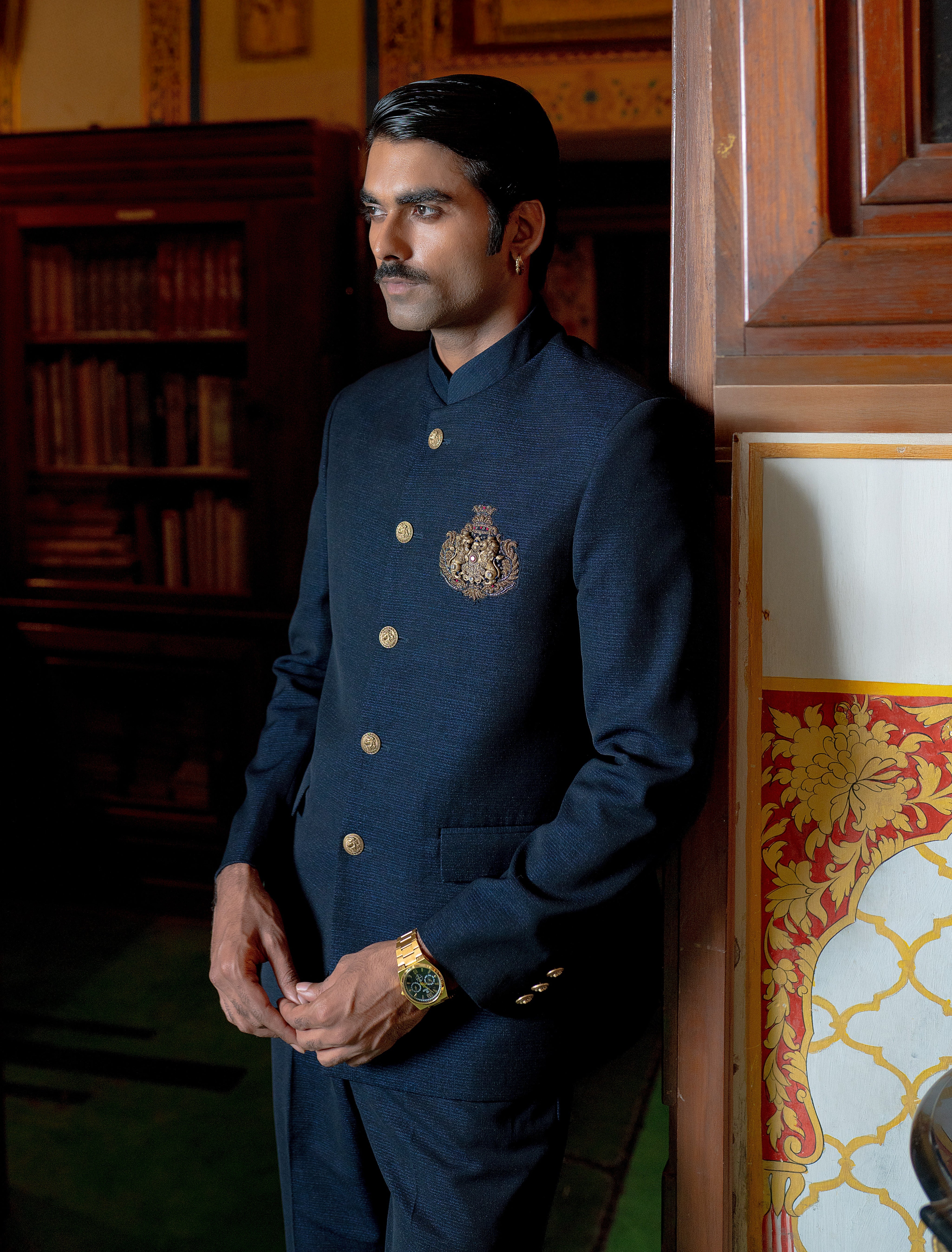 blue bandhgala with handcrafted lion brooch