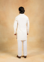 cream kurta set with pastel embroidery
