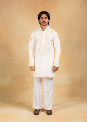 cream kurta set with pastel embroidery