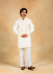cream kurta set with pastel embroidery