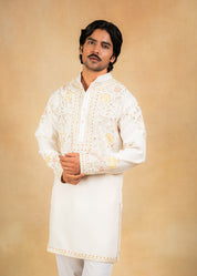 cream kurta set with pastel embroidery